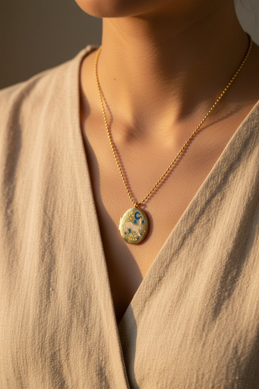 Necklace with a pendant worn by a person in a beige garment.