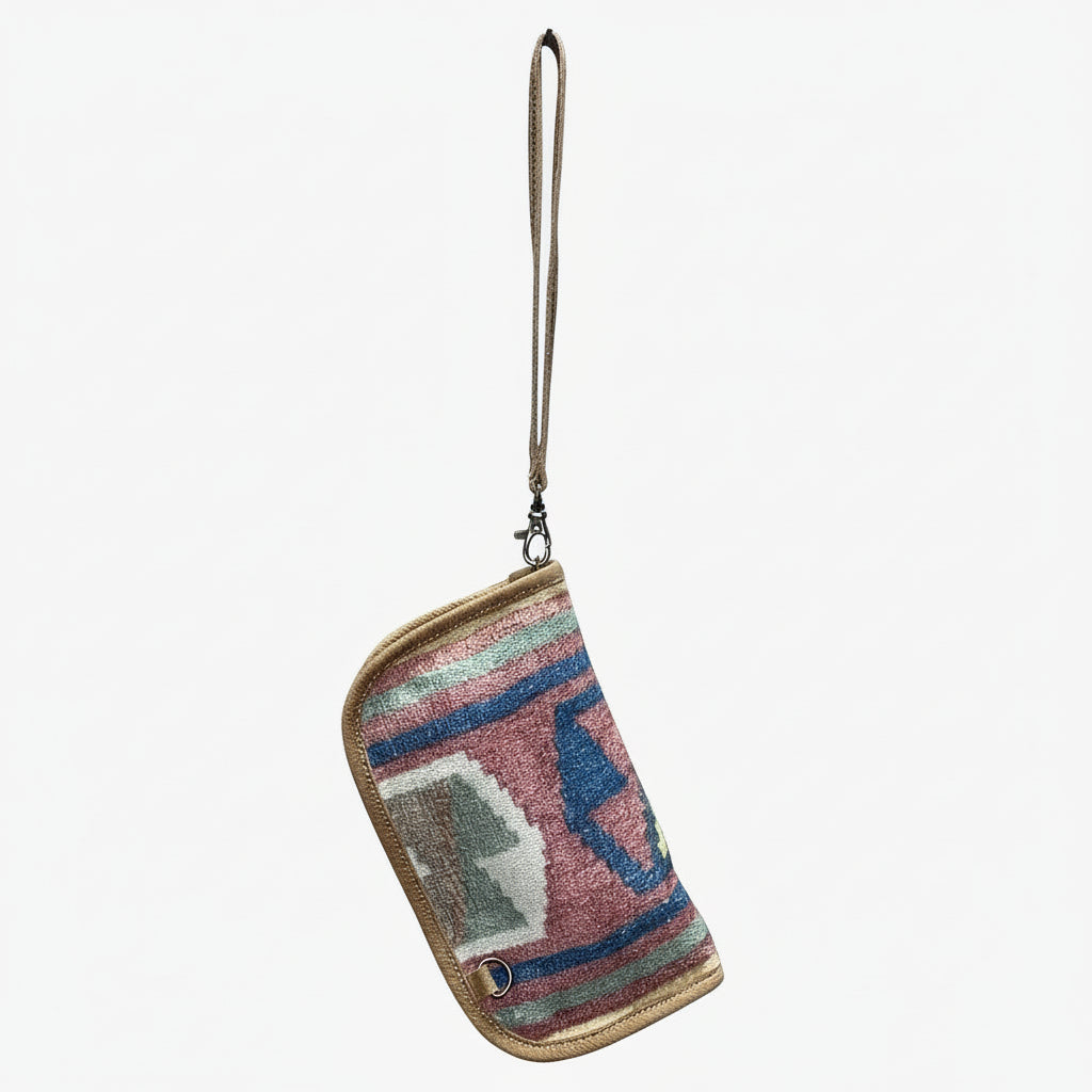 Multicolored patterned pouch with a strap on a white background