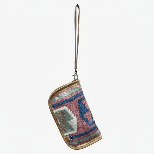 Multicolored patterned pouch with a strap on a white background
