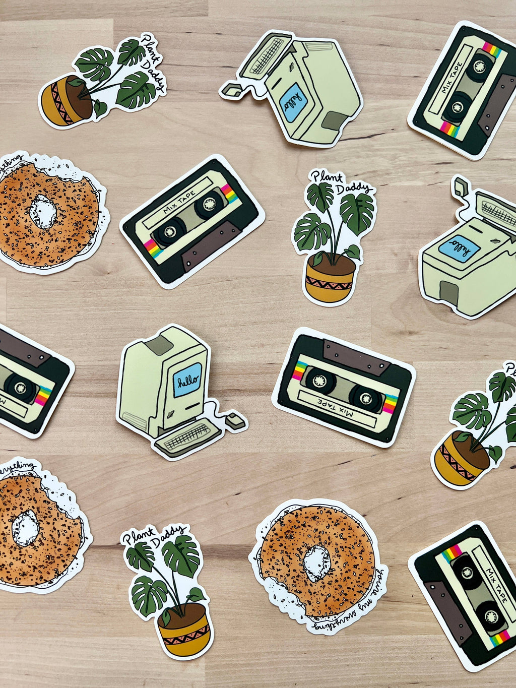 Playful vinyl sticker featuring a bagel with a heartfelt message with other vintage stickers