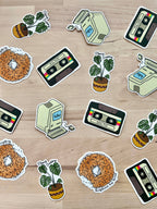 Playful vinyl sticker featuring a bagel with a heartfelt message with other vintage stickers
