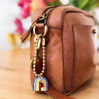 Bag charm styled on a denim leather bag