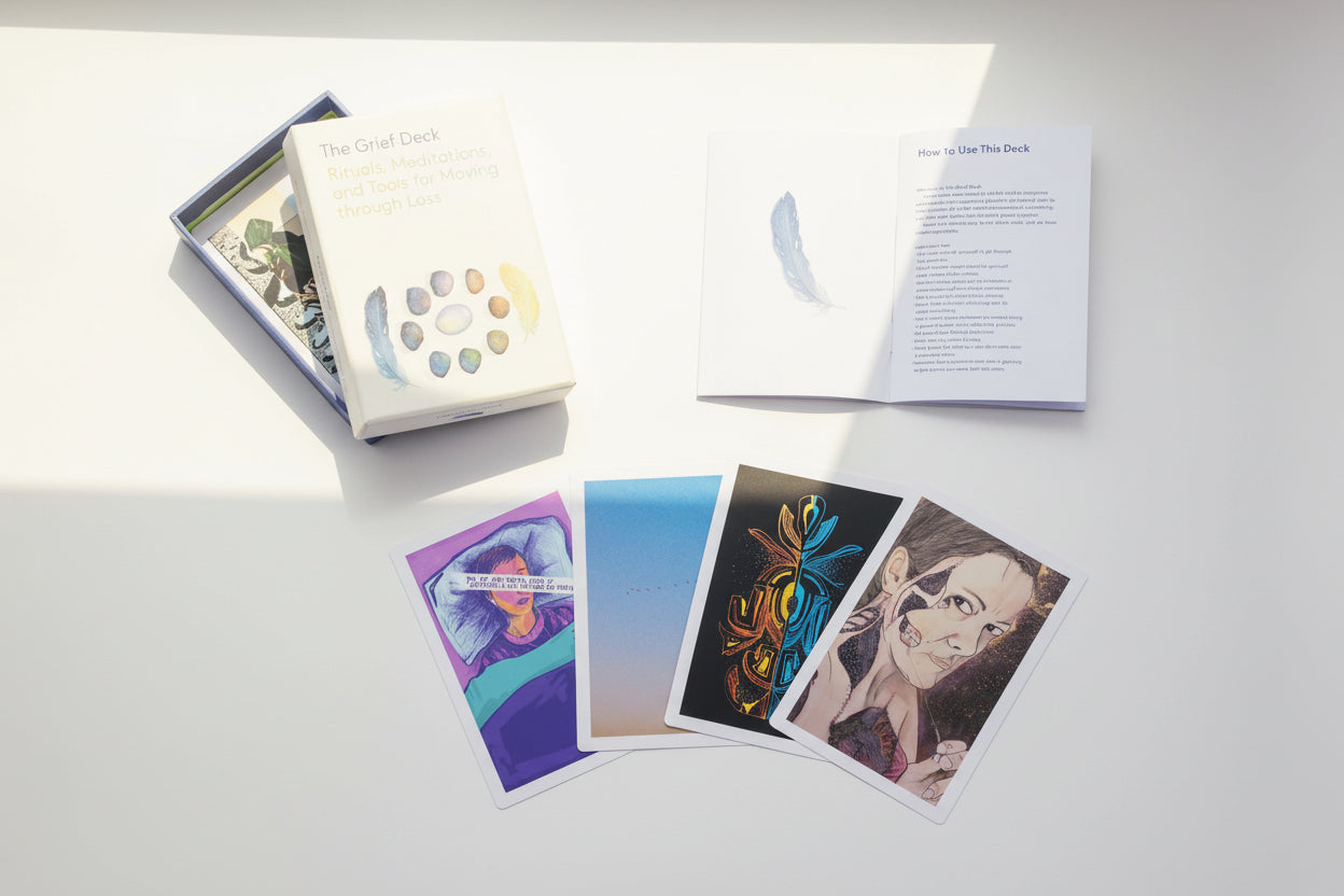 Set of tarot cards with a box and booklet on a white background
