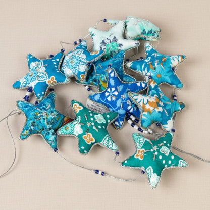 Close up view of the Embroidered Star Garland showing the beaded details