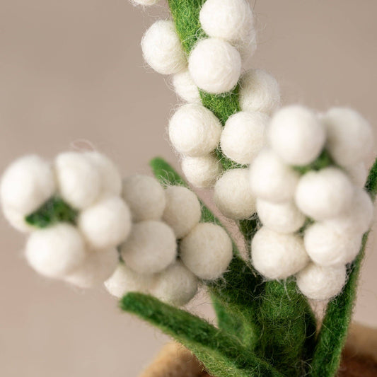 Close-up of handcrafted felted Baby’s Breath in a petite wool planter