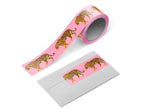 Close-up of washi tape unspooled across an envelope flap