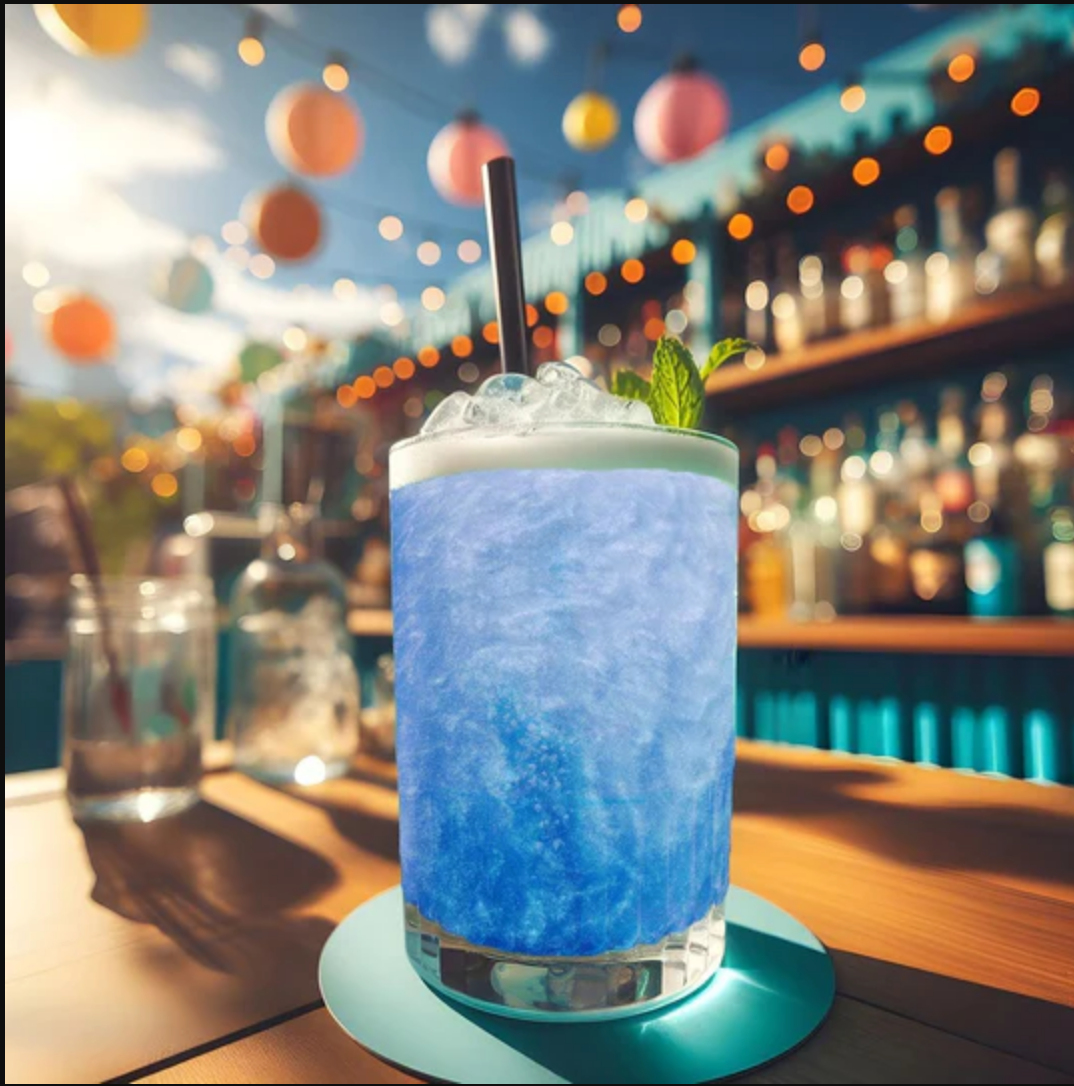 Close-up of a Blue Glitter Bomb dissolving into a clear sparkling beverage, releasing edible glitter.