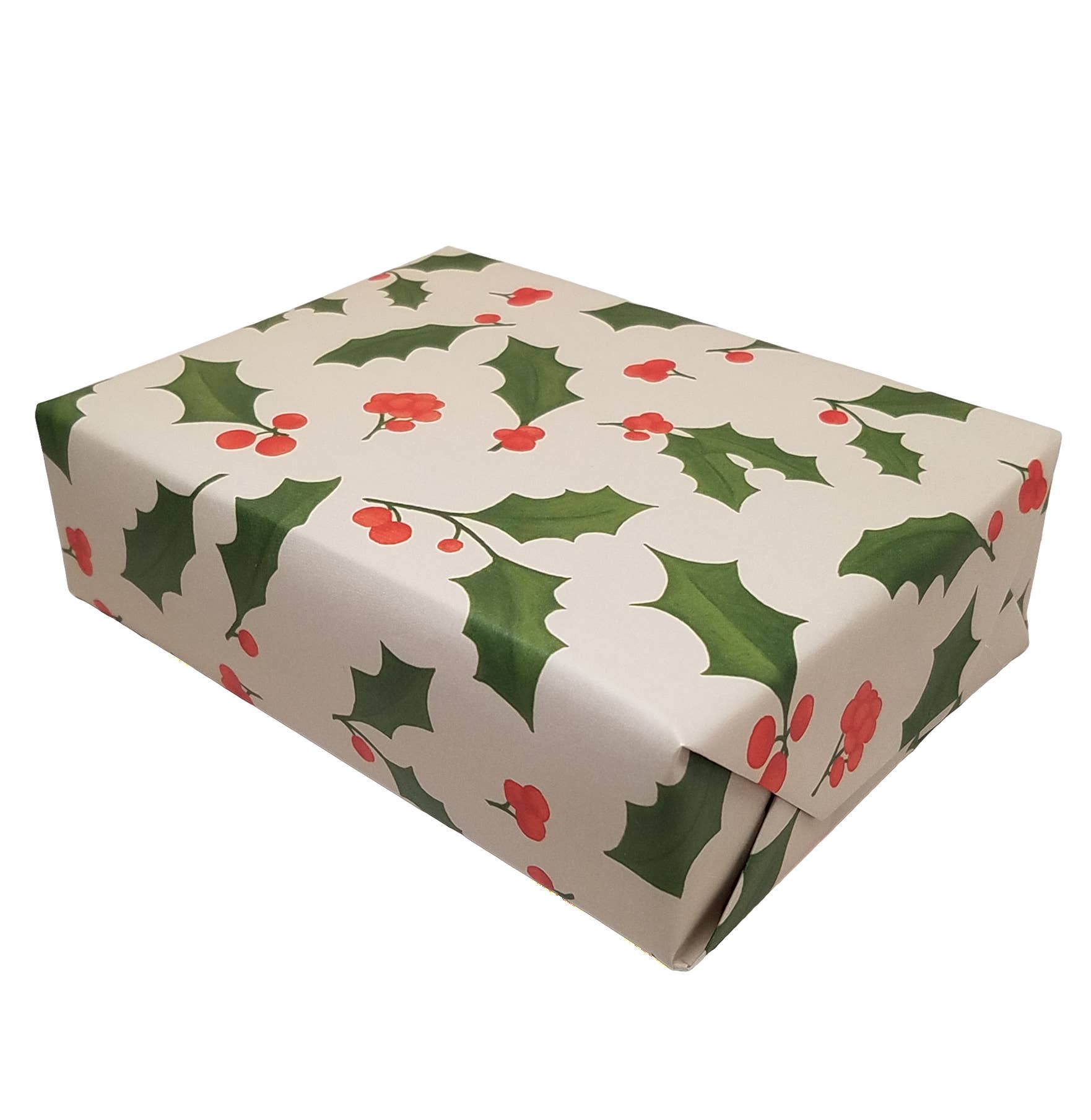 Rectangular box wrapped in holly leaf and berry patterned paper on a white background