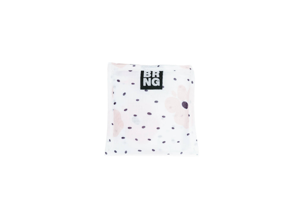 BRNG Carley Daily Shopper Mini bag with blush poppies and black polka dots folded into a compact size on a white background.