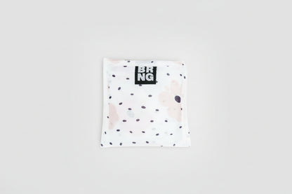 BRNG Carley Daily Shopper Mini bag with blush poppies and black polka dots folded into a compact size on a white background.