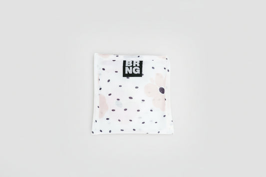BRNG Carley Daily Shopper Mini bag with blush poppies and black polka dots folded into a compact size on a white background.