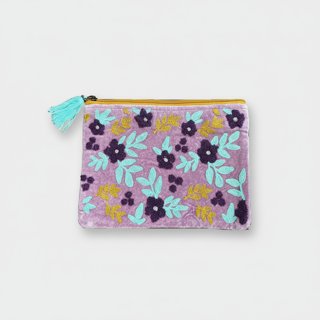 Floral-patterned pouch with a tassel on a white background