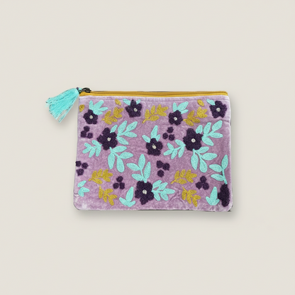 Floral-patterned pouch with a tassel on a white background