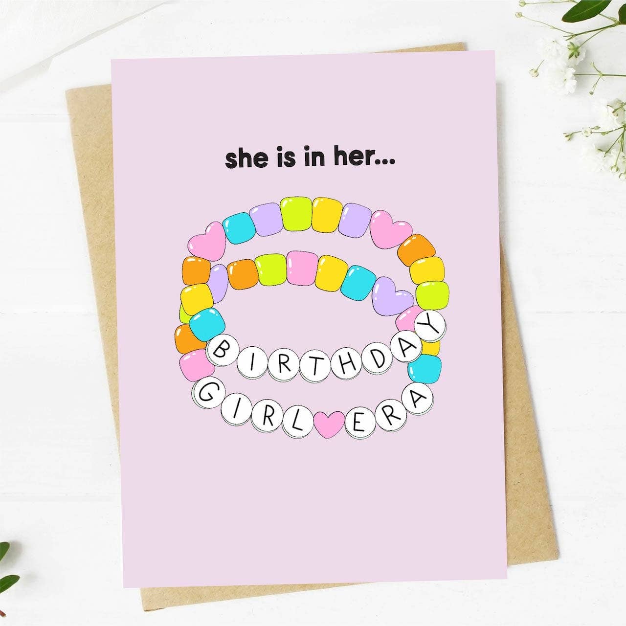 A colorful birthday card with the phrase 'She is in her Birthday Girl Era'