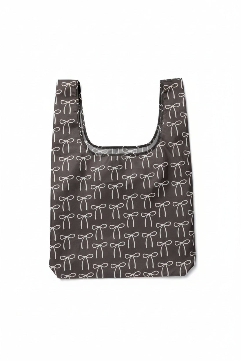 Chocolate brown tote bag with a bow pattern
