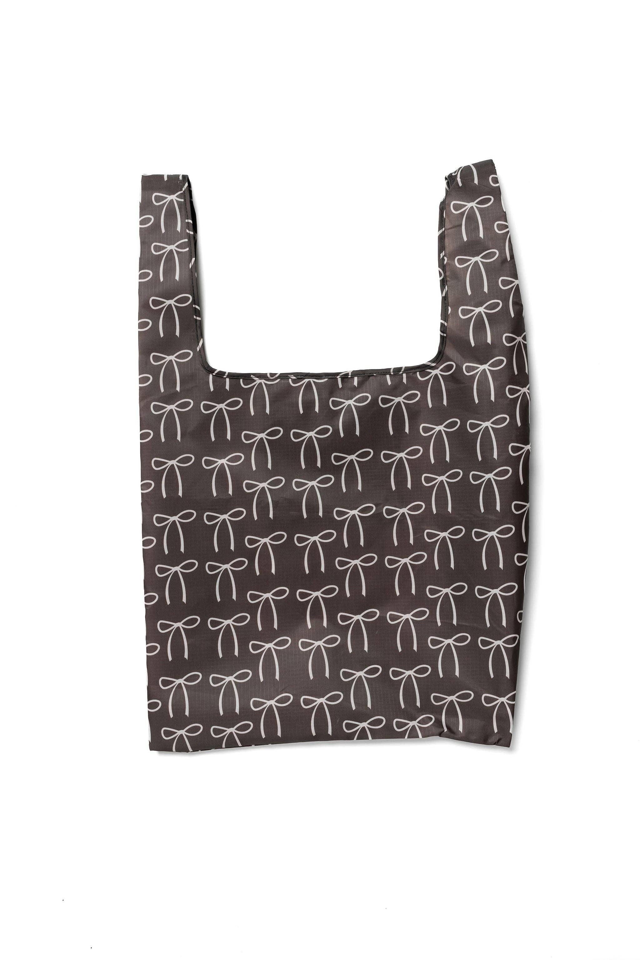Chocolate brown tote bag with a bow pattern