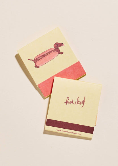 Close up of the front and back of dachshund design on the "HOT Dog Matches"