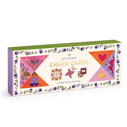 Box of Joy Laforme charm cards with colorful designs on a white background