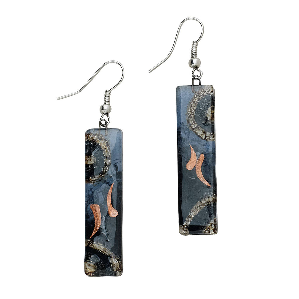 Fused glass earrings with iridescent colors and clean rectangular shape, handmade in Chile.