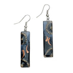 Fused glass earrings with iridescent colors and clean rectangular shape, handmade in Chile.