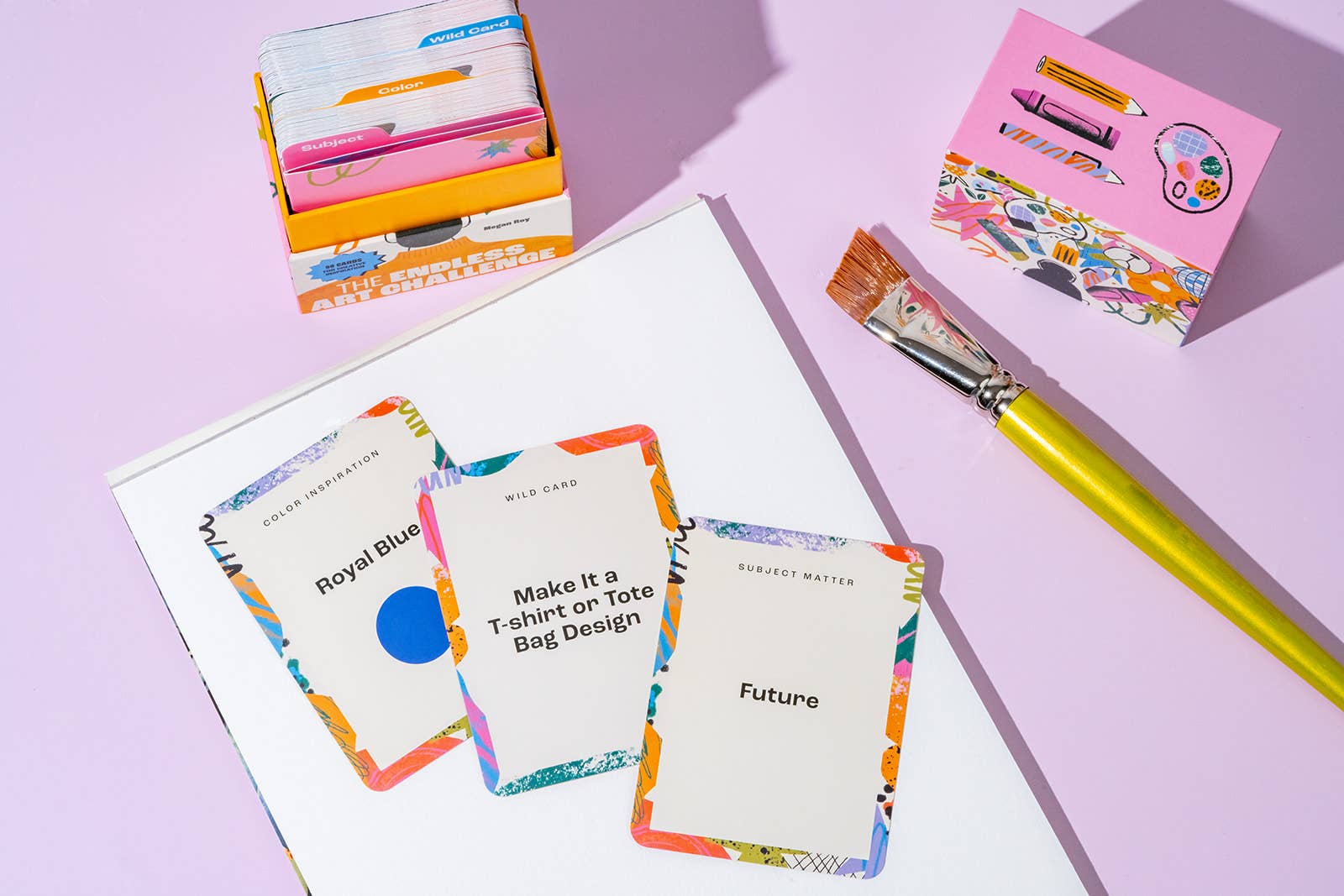 Color swatch cards with a paintbrush on a light purple background