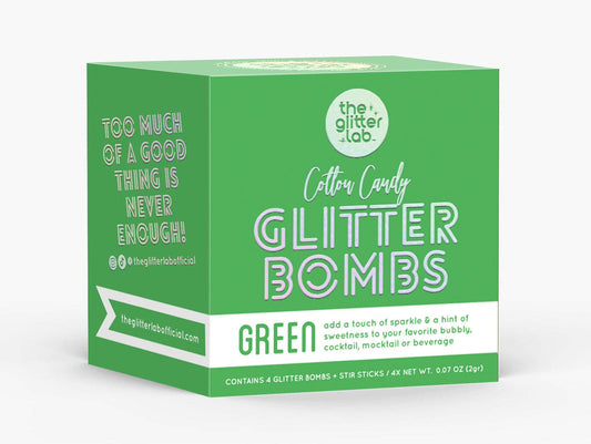 Box of Green Glitter Bombs with pouches and stir sticks, ready to add sparkle to any event.