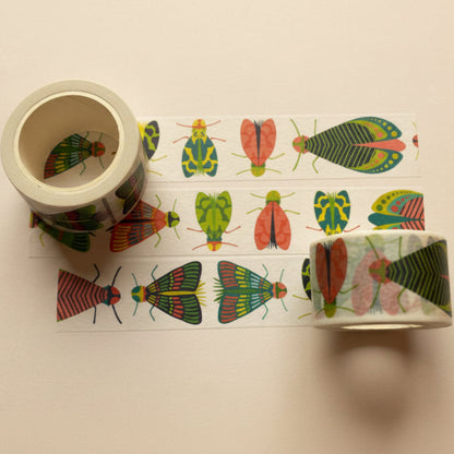 Roll of Mondo Bug Washi Tape featuring large colorful bugs on unspooled strip