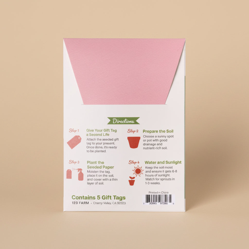 Seeded paper gift tag packaging with pink and white design on a white background