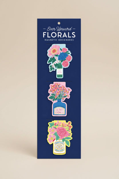 Packaging of floral magnetic bookmarks with 'Ever Upward' branding on a white background