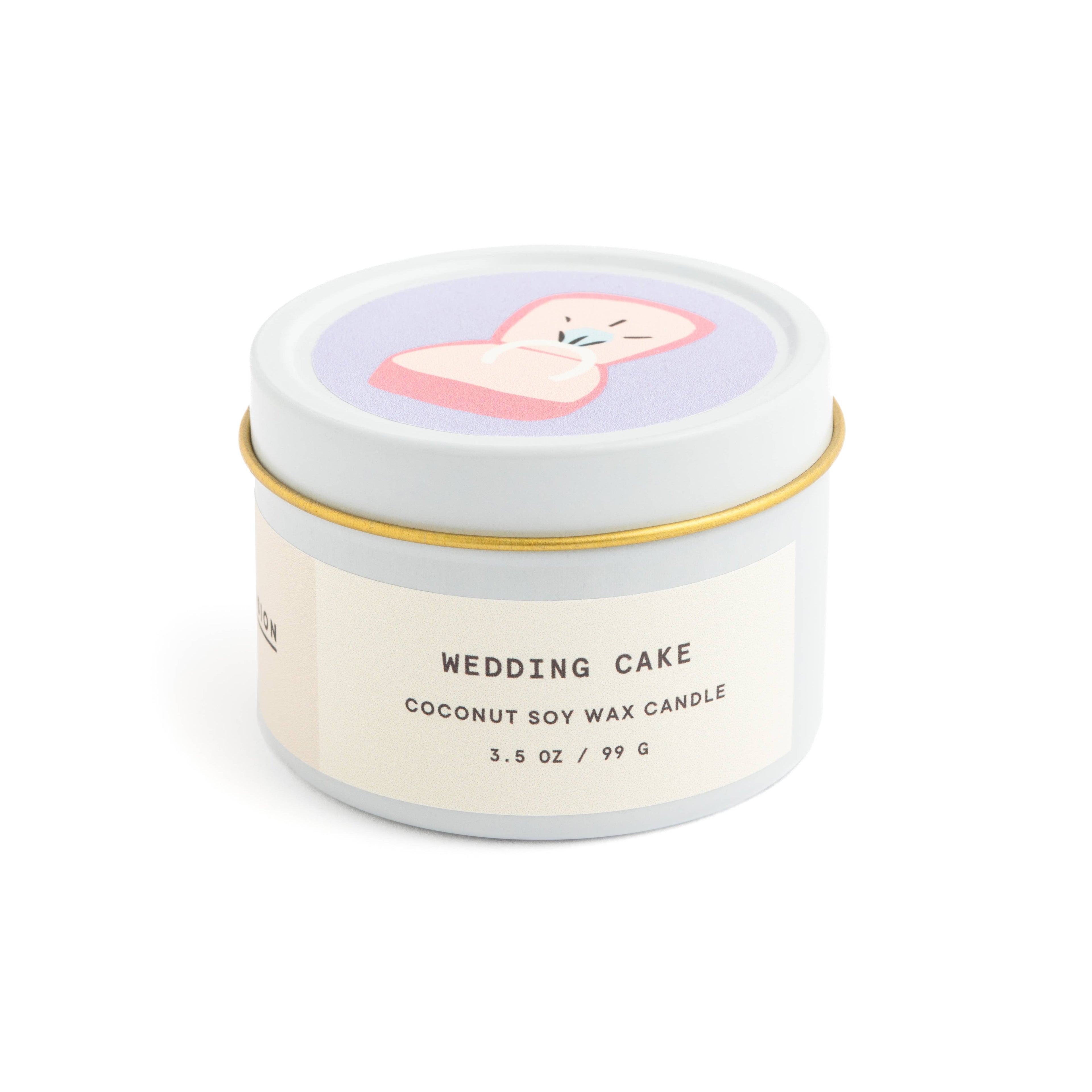 Wedding cake scented candle in white tin with corked vial of colorful matchsticks, packaged in a clear vinyl gift box.