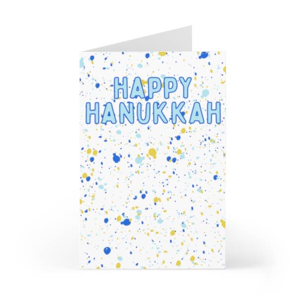 Close-up of textured paper and painterly abstract holiday card