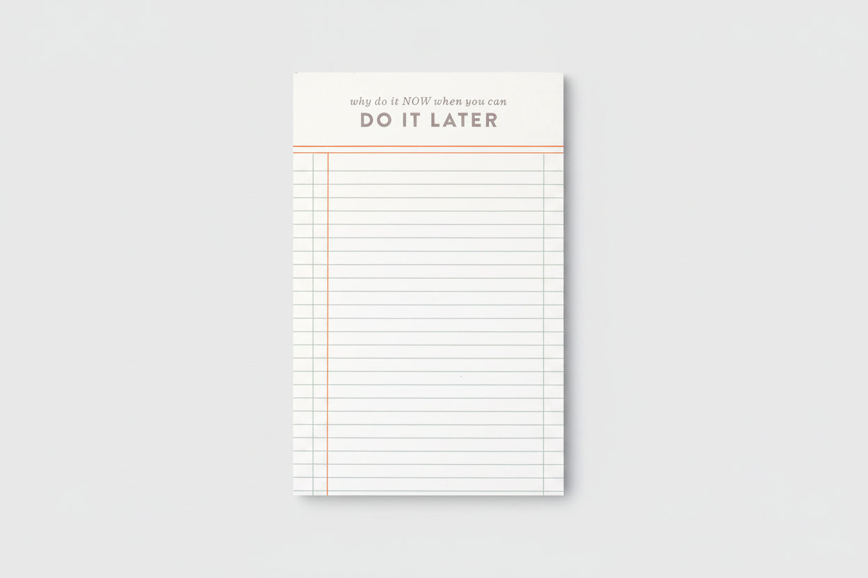 Notepad with lined pages and motivational text on a white background