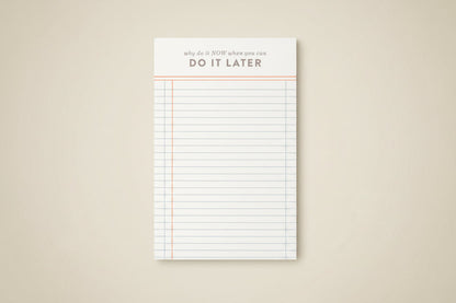 Notepad with lined pages and motivational text on a white background
