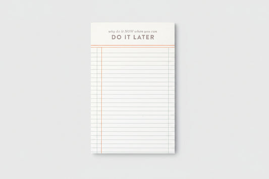 Notepad with lined pages and motivational text on a white background