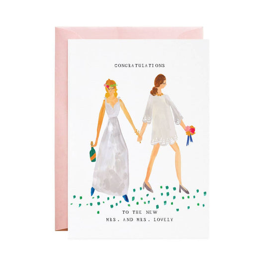 Wedding card with hand-lettered text: “Congratulations! To The New Mrs. & Mrs.”