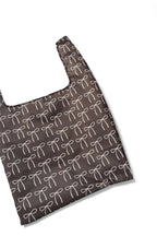 Claira Daily BRNG Shopper in chocolate with white bows unfolded on a white background.