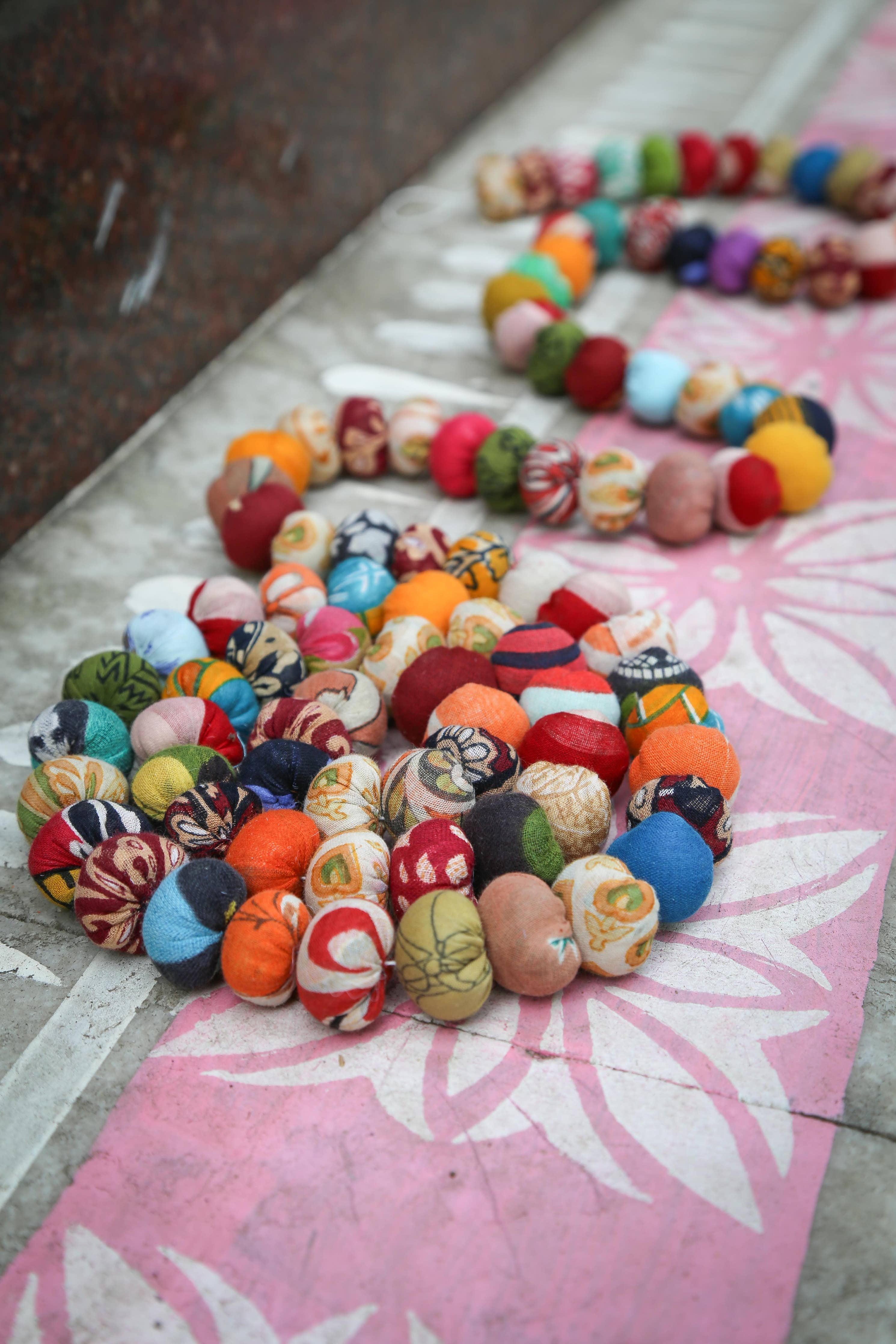 Sari bead garland coiled as a decorative accent on a festive table setup