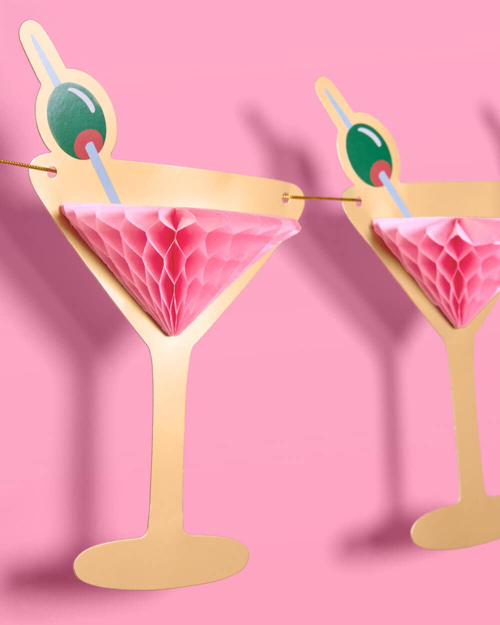 Martini banner with gold foil martini glasses, green olives, and pink tissue accents | 3D paper garland for parties