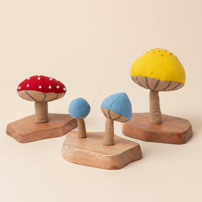 A trio of handcrafted fiber mushroom plants