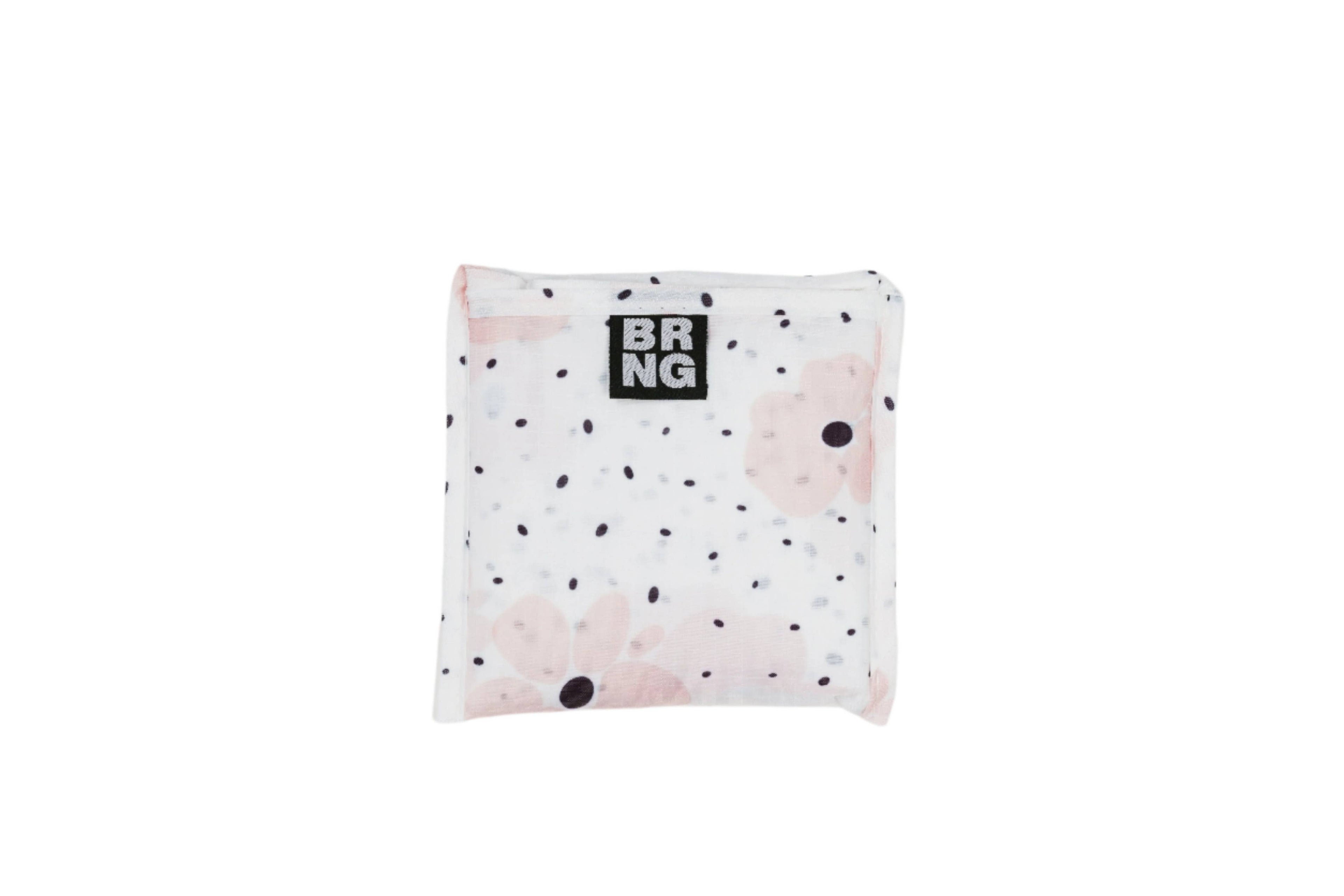 Carley Daily Shopper with pink flowers and black polka dots folded up into a compact size on a white background.