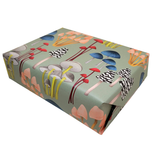 A gift wrapped in the Mushroom on Soft Green Gift Wrap Sheets from Rochambeau Home