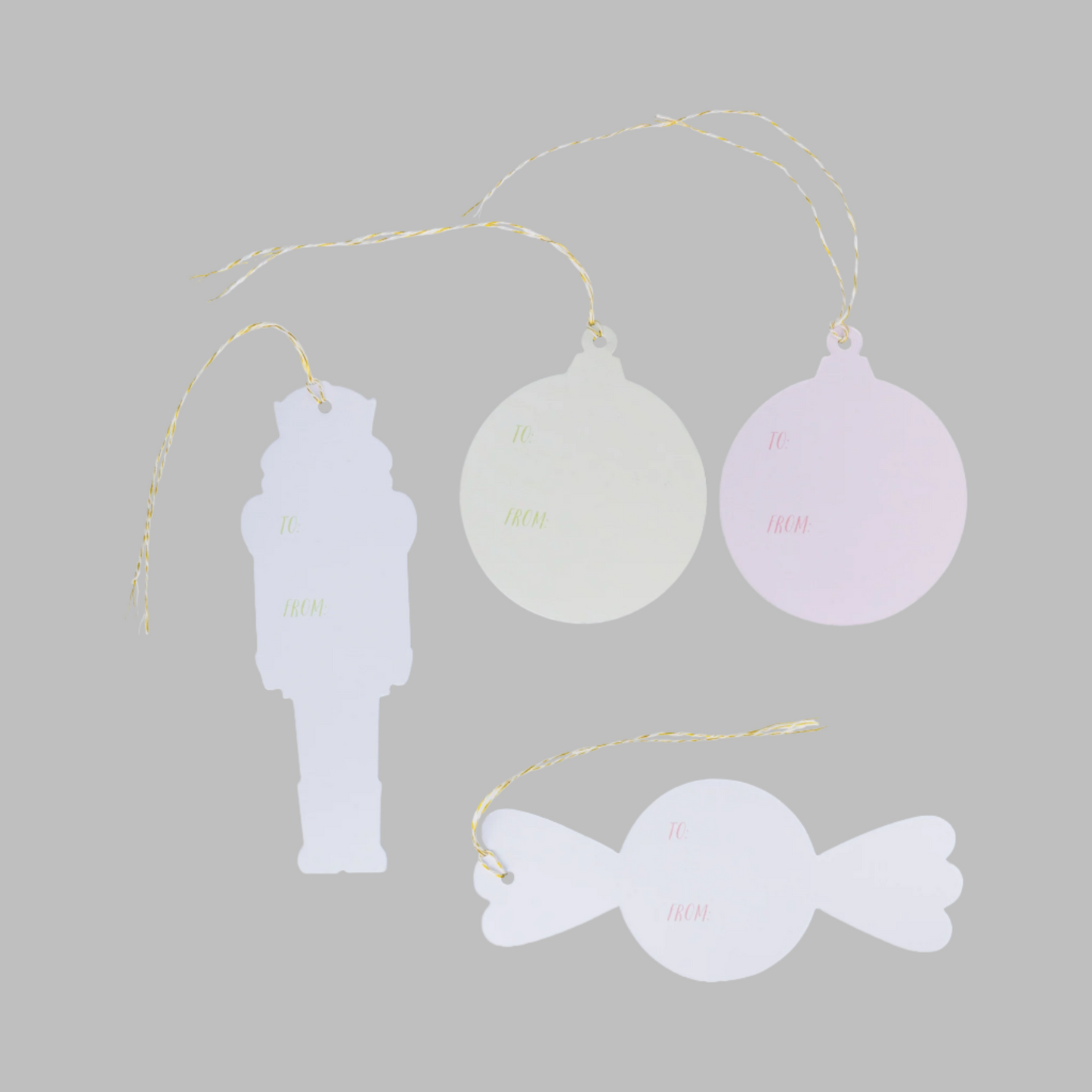 Decorative hanging tags shaped like a soldier, candy, and heart on a white background