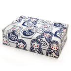 A gift wrapped in the Matryoshka Doll Holiday Gift Wrap with a white background