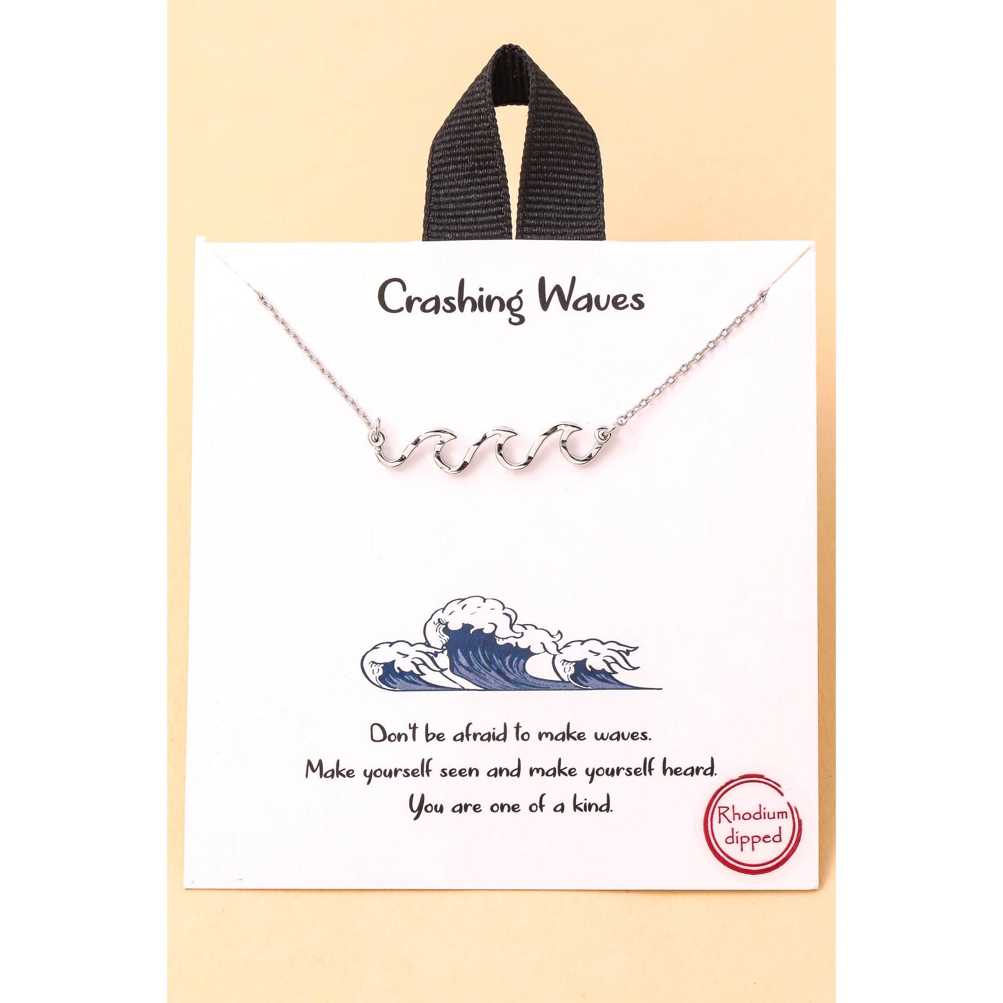 Pendant detail symbolizing movement and strength