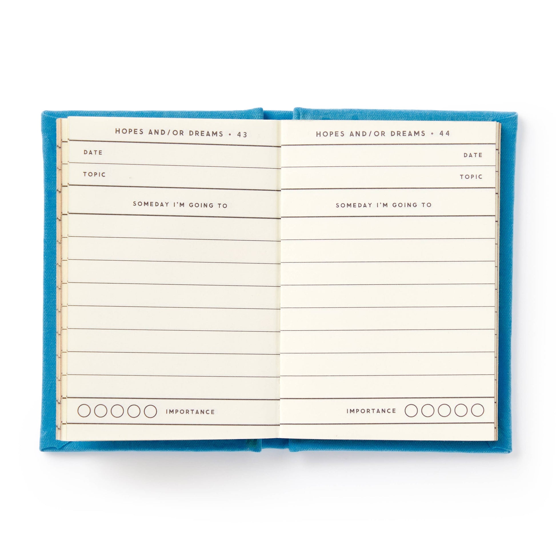 Open notebook with blue cover on a white background