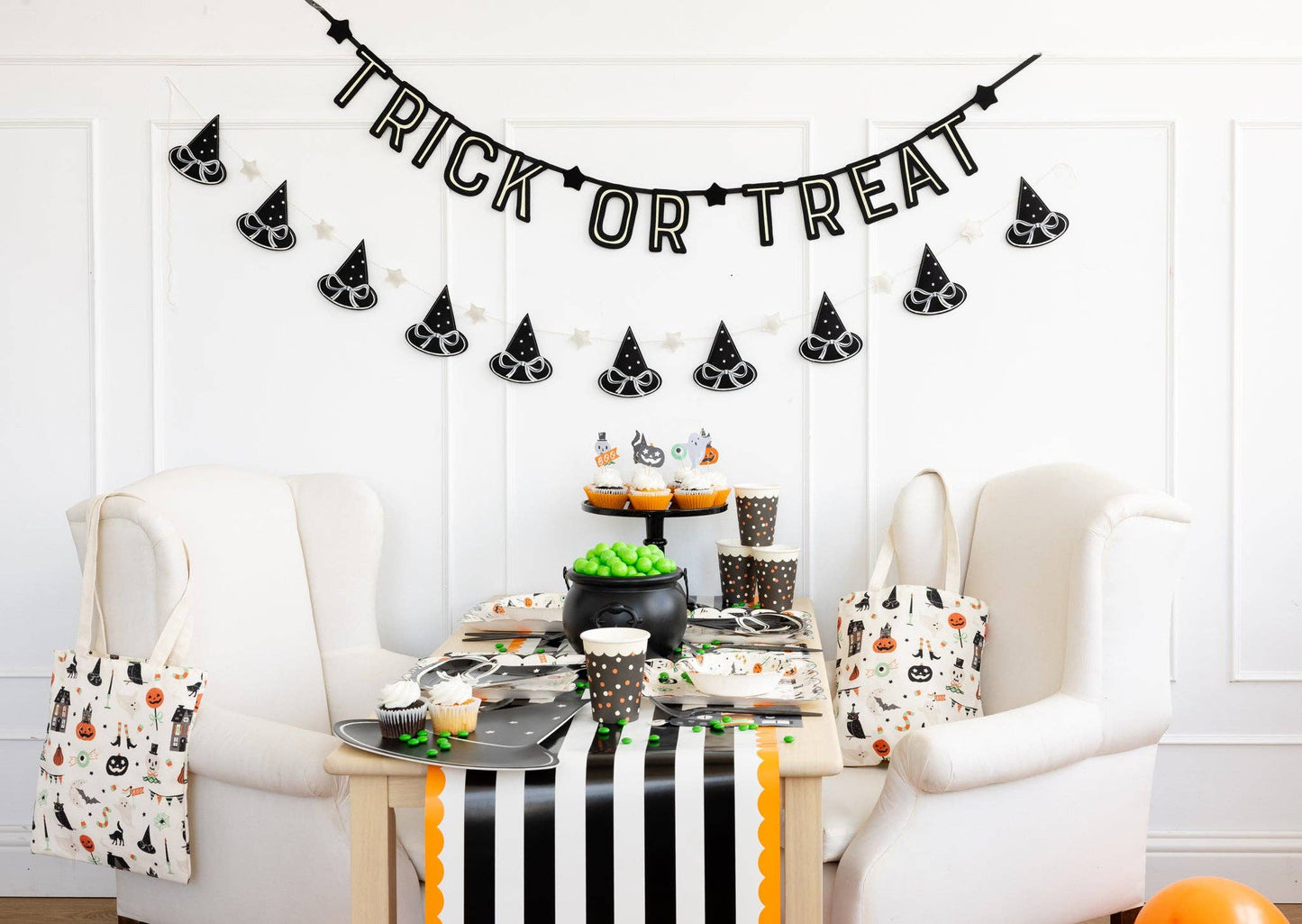 Six-foot witch hat banner displayed above party table with seasonal décor