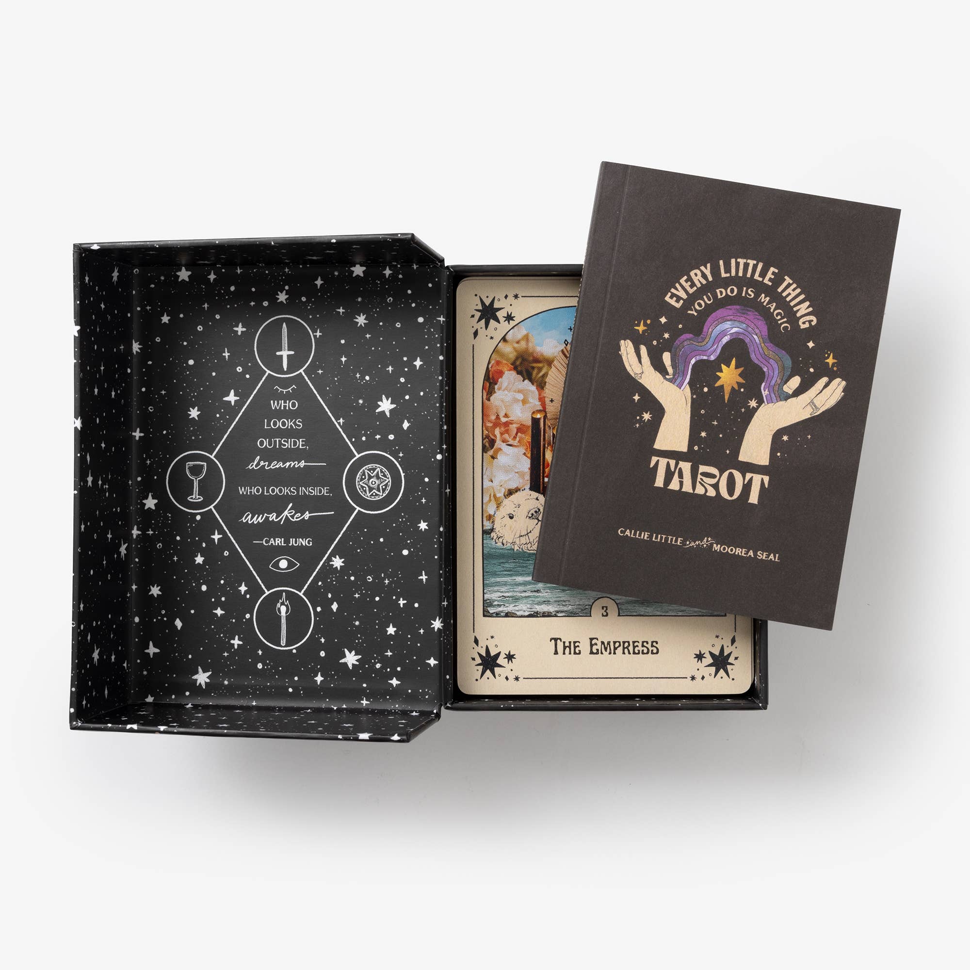 Tarot card set with a black box featuring star patterns and tarot cards inside.