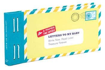 Close up view of “Letters to My Baby” book with pastel fold-and-mail envelopes and gold foil accents
