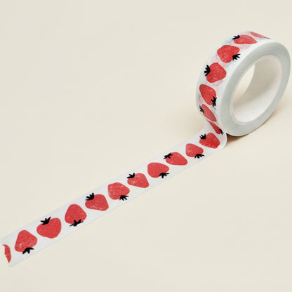 Roll of washi tape with strawberry pattern on a white background