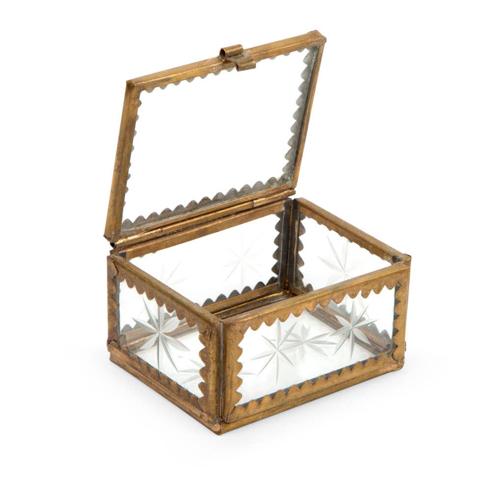 Image of the glass box open showing the details of the brass and etched glass with stars